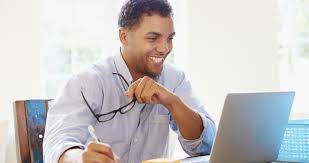 A young teacher using a computer.